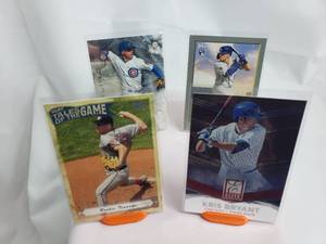 lot 28 image: Stephen Strasburg Rookie Tsunami, Kris Bryant Panini Elite, Javier Baez Bowman Sterling, Gavin Lux Topps Rookie Card