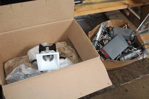 lot 82 image: Lot of (4) Flood Light  Spot Light (New in Package) with Box of Misc. Lights, Cords, Power Box