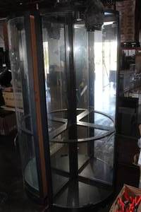 lot 143 image: Howard Miller 680-609 WoodGlass Lighted Mirror-Back Corner Display Cabinet