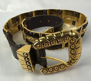 lot 178 image: Vintage Gold & Black Leather Captiva Belt with 3 Extra Links