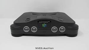 lot 39 image: Nintendo 64 with original cords, 2 original Nintendo 64 controllers, 4 original Nintendo 64 games