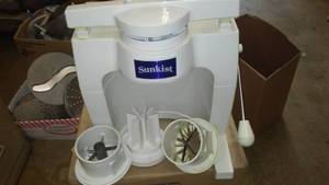 lot 335 image: Sunkist Fruit Slicer and Attachments. Sectionizer