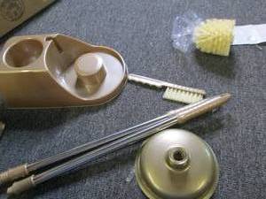 gold plunger and toilet brush ...