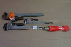 lot 192 image: Damaged Adjustable Pipe Wrenches and Sink Removal Tool