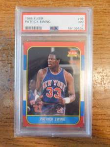 lot 81 image: PSA 7 1986 Fleer Patrick Ewing Rookie #32