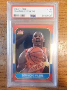 lot 82 image: PSA 7 1986 Fleer Dominique Wilkins Rookie #121