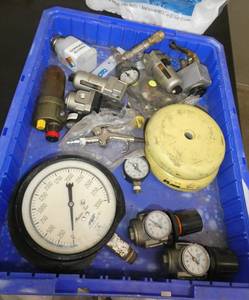 Bin of pressure gauges and a couple Barrymount pads - bin not included