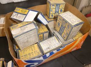 Box of vintage car parts