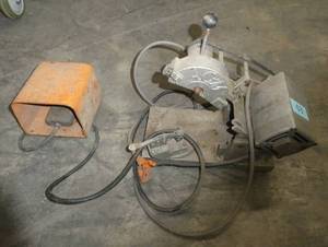 I am guessing this is a saw, could be a grinder ACM brand, with foot pedal
