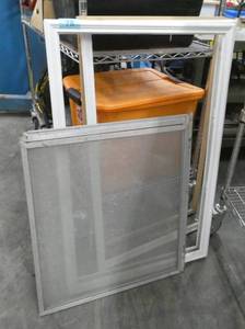 Group of storm windows and screen and window framingtrim