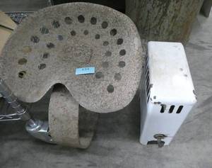 old tractor seat and small heater box