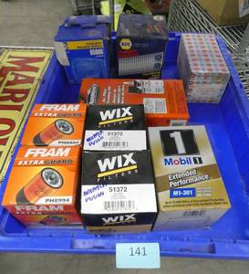 Bin of halogen car lights and oil filters (bin not included)