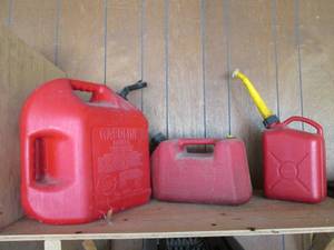 3 plastic gas cans...