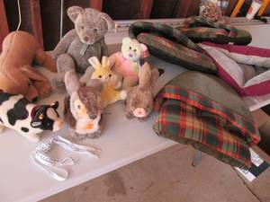 4 cat beds, 7 stuffed animals and p...