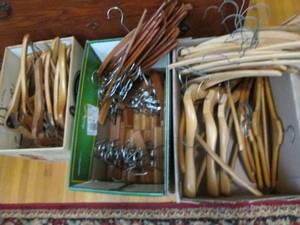 3 boxes of wood hangers (see )...
