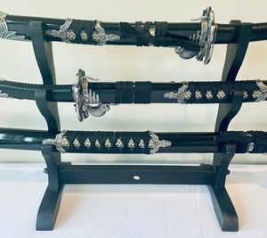 lot 2 image: 3 Japanese Samurai Katana Swords on a Display Rack