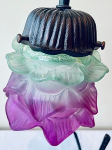 lot 25 image: Cast Iron Lamp with Sitting Fairy, Floral Stem and Frosted Glass Shade