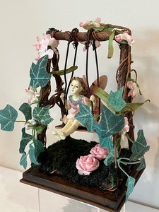 lot 53 image: Adorable Fairy Figurine on a Swing