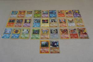lot 243 image: Binder Pages of Pokemon Cards - Holos, Red Numbers, 1st Editions