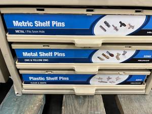 ASSORTED SHELF PINS WITH CABINET