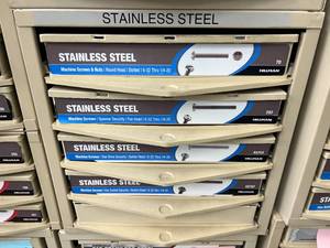 ASSORTED STAINLESS STEEL SCREWS AND NUTS WITH CABINET