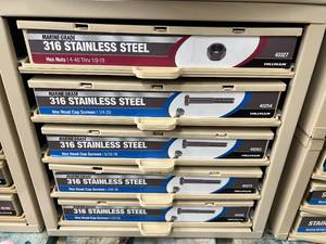 ASSORTED STAINLESS STEEL CAP SCREWS AND NUTS WITH CABINET