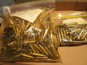 lot 142 image: Brass 223, ready to load, approx 7...