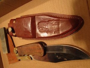 lot 157 image: Folding knife - Pakistan, leather s...