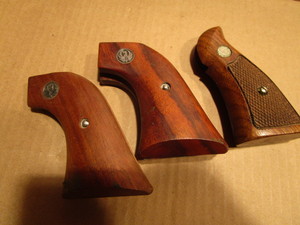 lot 159 image: Pistol grips two Ruger, one Smith ...