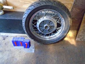 Older front motorcylcle wheel & tire. Size 14080-15. As shown.