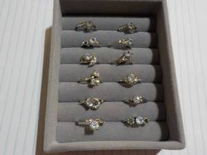 12 Cubic Zirconia Rings in a Displa...