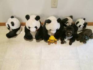 lot 63 image: Family of pandas and other animals...
