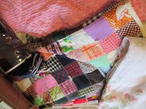 lot 89 image: Vintage luggage and quilts...