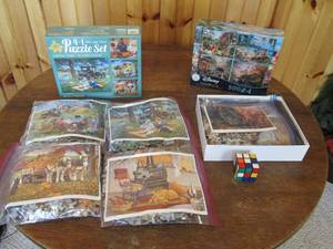 lot 115 image: Several puzzles and rubix cube (see...