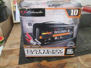 lot 154 image: Battery charger that is slightly de...