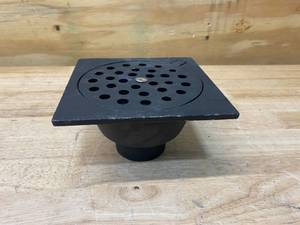 lot 118 image: Jones Stephens 6 in. x 6 in. x 2 in. No Hub Cast Iron Bell Trap Hinged Lid