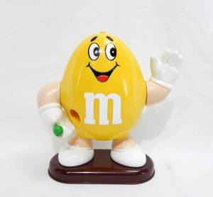 lot 129 image: M and Ms Candy Dispensers - 1992 Yellow Peanut