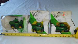lot 29 image: (3) John Deere Tractors In Boxes