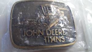 lot 36 image: John Deere Belt Buckle Titans Combine