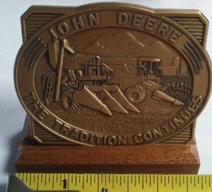 lot 38 image: John Deere Desk Plaque The Tradition Continues