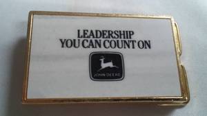 lot 51 image: John Deere Belt Buckle Leadership You Can Count On