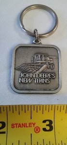 lot 106 image: John Deere Keychain, New Titans Combine.