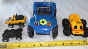 lot 146 image: (3) Big Tire Toy Trucks.