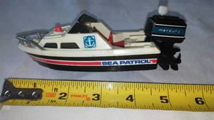 lot 148 image: 1978 TOMY Sea Patrol Boat Wind Up Mercury Motor