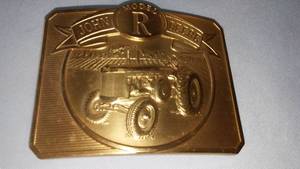 lot 186 image: John Deere Belt Buckle Model R. Tractor.