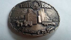 lot 276 image: Belt Buckle ND Grain Dealers Assn. 75 Years