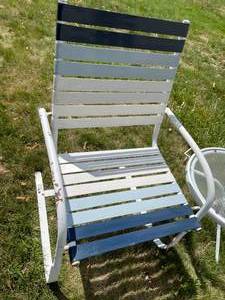 lot 328 image: 2 Patio Chairs with One Being a Rocker and a Center Table