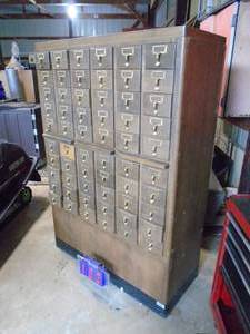 Wood library card cabinet. 41 x 60 x 17. Top 2 left drawers need to be glued. Otherwise in nice shape. As shown.