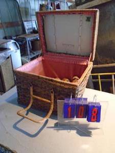 Wicker picnic basket with steins & stoneware. As shown.