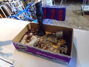 Flat of costume jewelry. As shown.